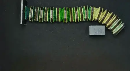 Origami robotic arm catching an object